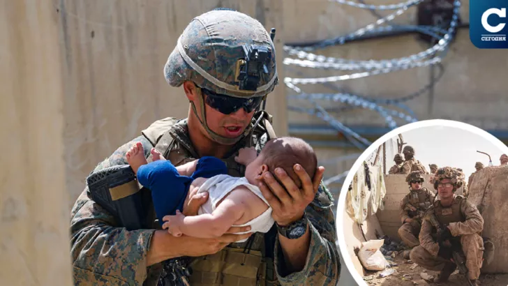 Афганцы, потерявшие надежду улететь, передают солдатам НАТО своих детей / Фото Reuters