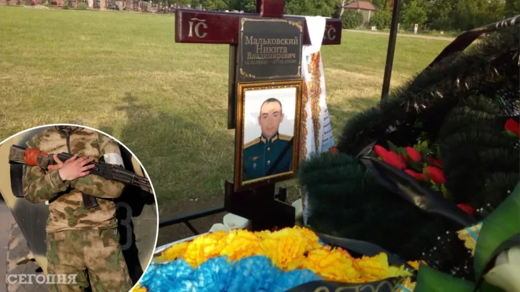 На могилу российскому военному принесли желто-голубой венок