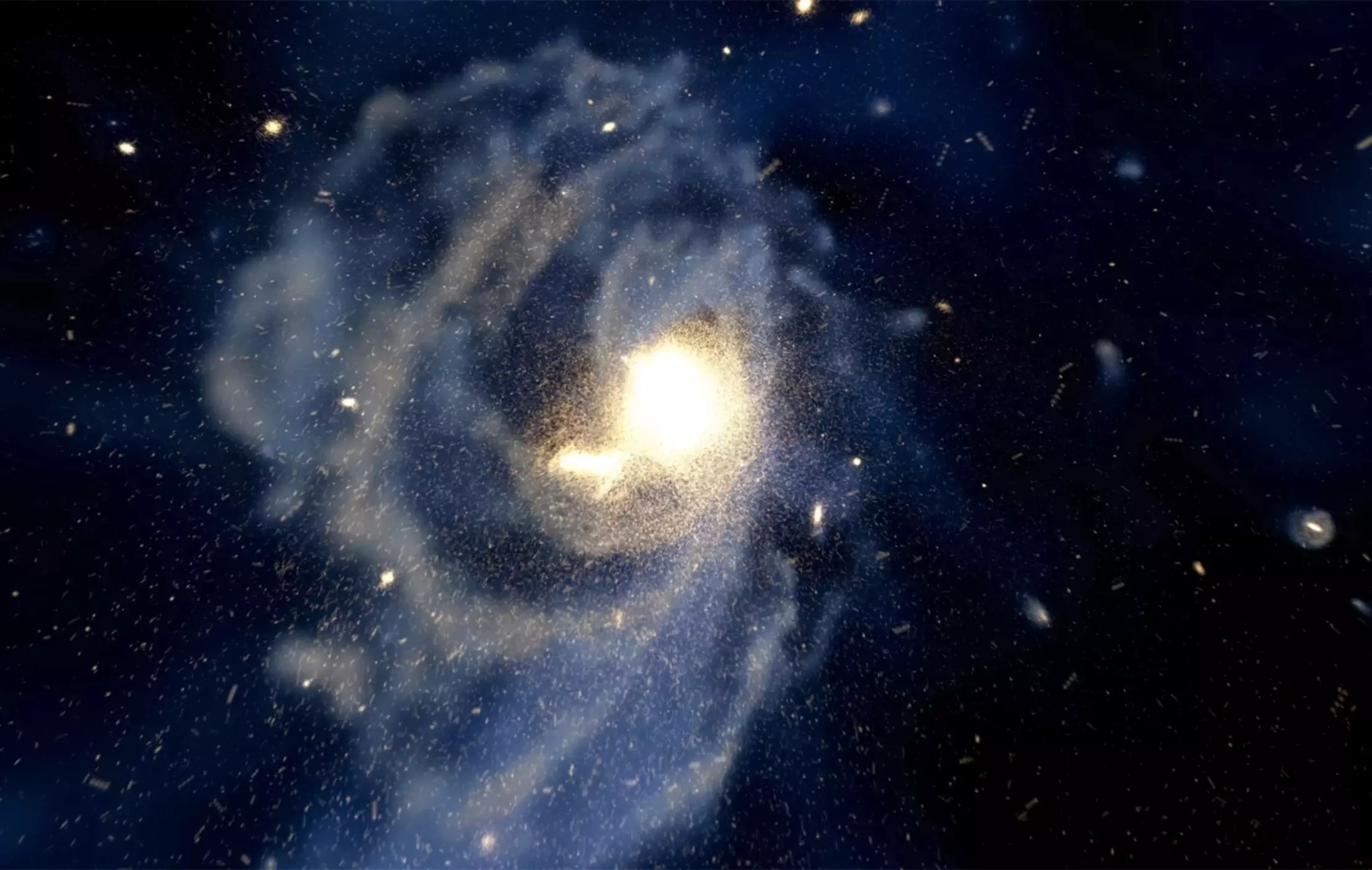 Компьютерная симуляция формирования спиральной галактики, гало которой частично образуется из скопления множества маленьких галактик, а также "чужих" звезд в них