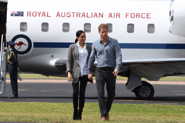 Меган Маркл і принц Гаррі в Австралії. | Фото: Фото: AFP