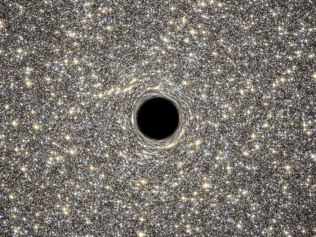 У центрі яскравої надкомпактної карликової галактики M60-UCD1 "проживає" гігантська  надмасивна чорна діра масою в 15 відсотків від маси всієї галактики. Астрономам вдалося зробити це відкриття, використовуючи дані телескопа "Хаббл" і наземних обсерваторій. M60-UCD1 – одна з найбільш щільних і крихітних галактик, відомих науці. Вона розташовується поблизу масивної еліптичної галактики NGC 4649, яку також називають M60, на відстані близько 54 мільйонів світлових років від Землі в сузір'ї Діви. Фото: AFP