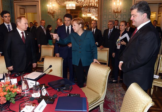 Путін, Ангела Меркель і Порошенко. Фото: AFP