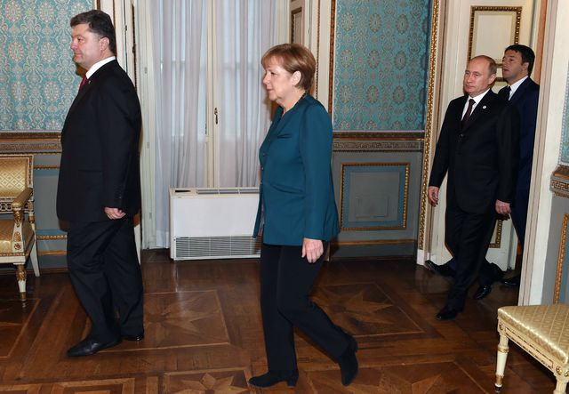Порошенко, Меркель і Путін. Фото: AFP